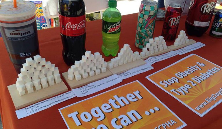 Sugar Cubes On Display In Front Of The Beverage They Represent