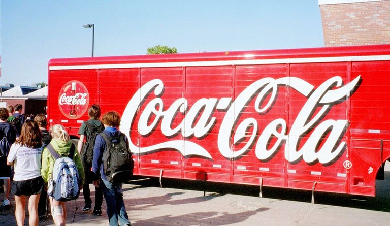 Students Walking By A Coca-Cola Truck