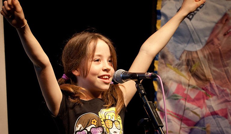 Girl Standing At The Microphone