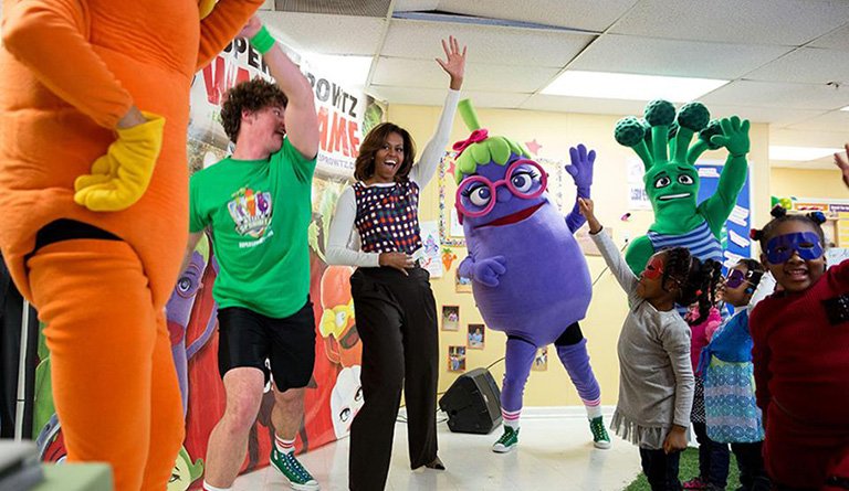 Michelle Obama dancing with "Let's Move" Mascots In A Classroom