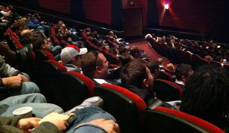 Patrons Watching A Film In A Movie Theater
