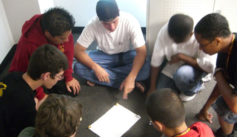 Students Sitting On The Floor